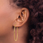 Загрузить изображение в средство просмотра галереи, 14K Yellow Gold 41mm x 1.5mm Endless Round Hoop Earrings
